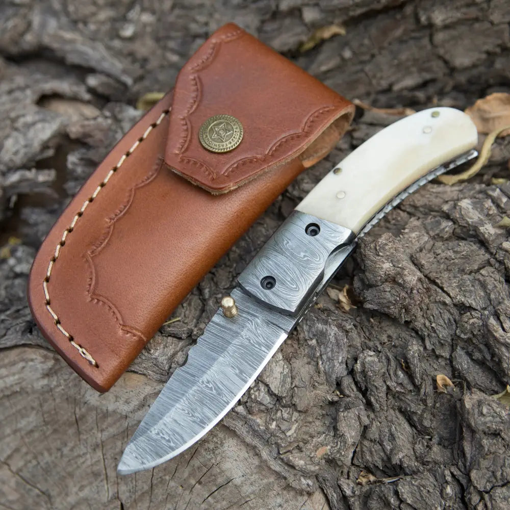 http://whitehillsknives.com/cdn/shop/files/custom-hand-forged-damascus-steel-hunting-folding-knife-with-bolster-camel-bone-handle-wh-3536-317.webp?v=1686286850